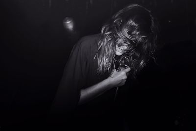 High angle view of woman singing at concert