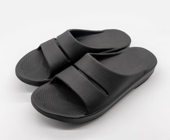 Close-up of shoes over white background