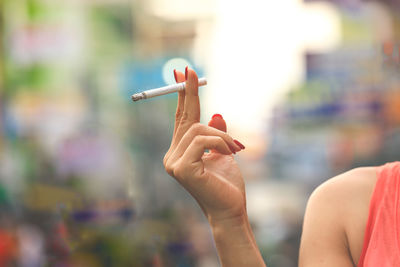 Woman hand holding cigarette