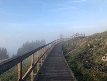 Bridge over footbridge against sky