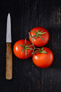 High angle view of tomatoes on wooden table