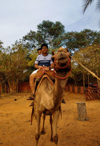 Full length of man riding horse