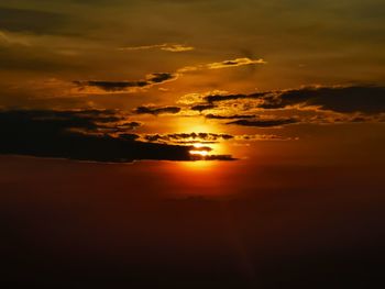 Scenic view of dramatic sky over sea during sunset