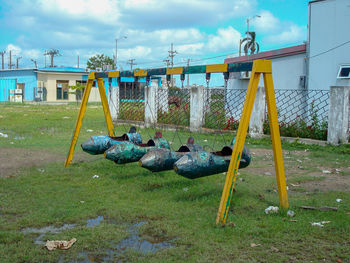 View of swing in playground against sky