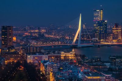 Erasmusbrug and illuminated cityscape at night