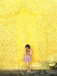 Girl holding a toy outdoors