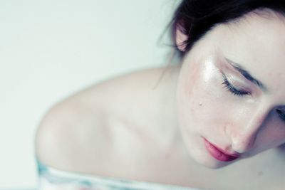 Close-up of young woman with eyes closed