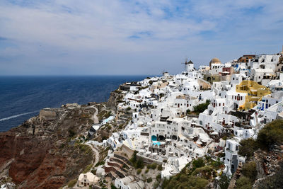 High angle view of townscape by sea against sky. santorini