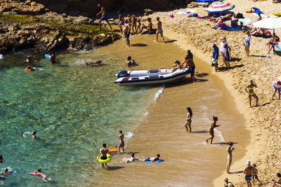 High angle view of people on sea shore