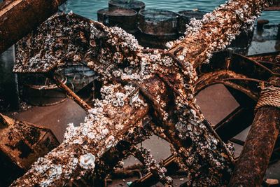 Close-up of rusty chain on metallic structure