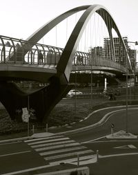 Bridge against sky in city