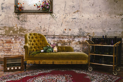 Potted plant on table against wall at home