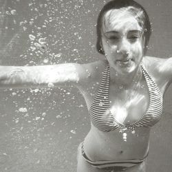 Portrait of young woman in swimming pool