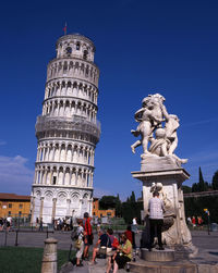 Low angle view of statue against blue sky