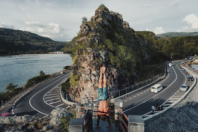 Panoramic view of road by mountain against sky