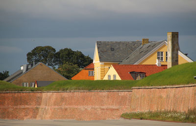 Houses against sky in city