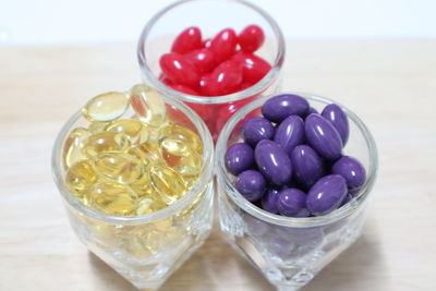 High angle view of candies in glass on table