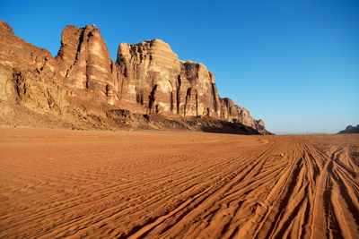 Rock formations in desert against clear sky