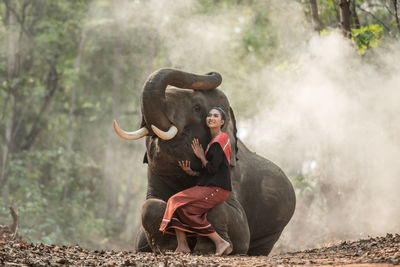 Siblings on land in forest