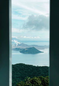 Scenic view of sea seen through window