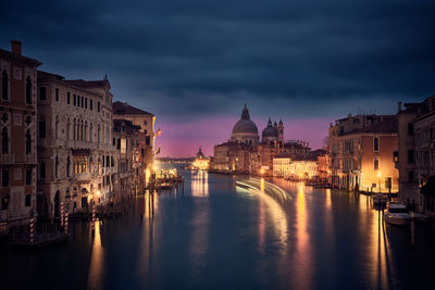 View of illuminated city at waterfront