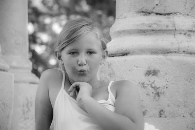 Portrait of girl blowing a kiss