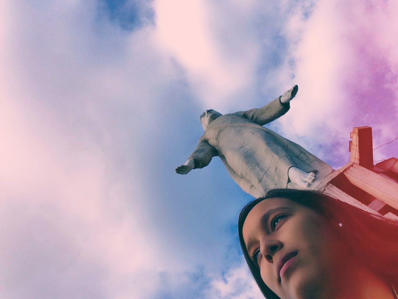 sky, low angle view, cloud - sky, person, lifestyles, leisure activity, cloud, cloudy, childhood, looking at camera, young adult, outdoors, day, portrait, front view, headshot, side view