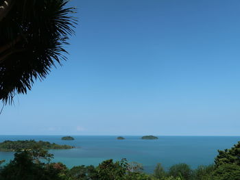 Scenic view of sea against clear blue sky