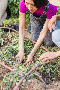 Low section of man gardening