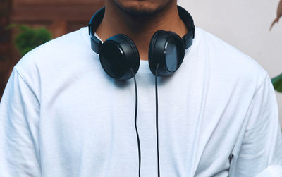 Close-up of man photographing with camera