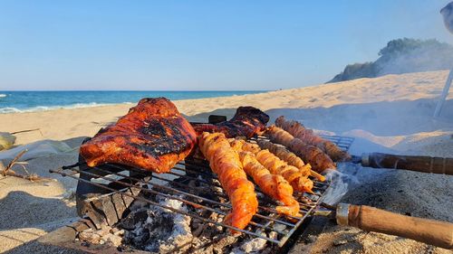 High angle view of meat on barbecue grill