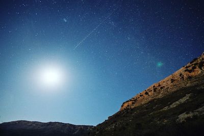 Low angle view of moon in sky at night