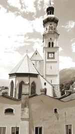 Low angle view of clock tower against sky