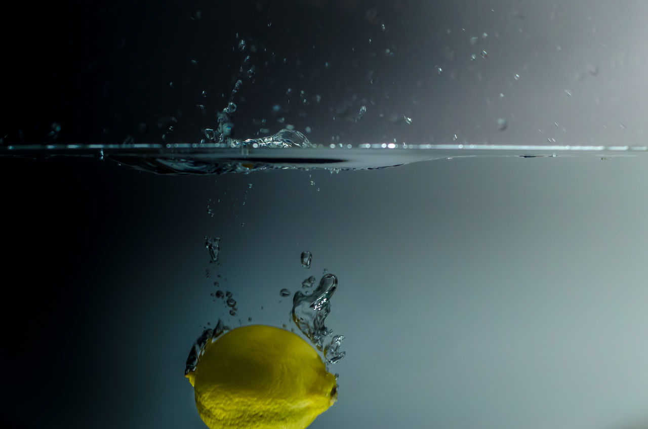 CLOSE-UP OF WATER SPLASHING IN SEA