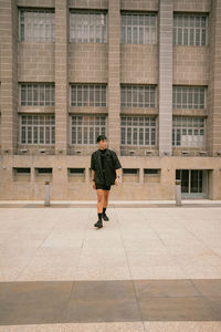 Rear view of man walking on walkway