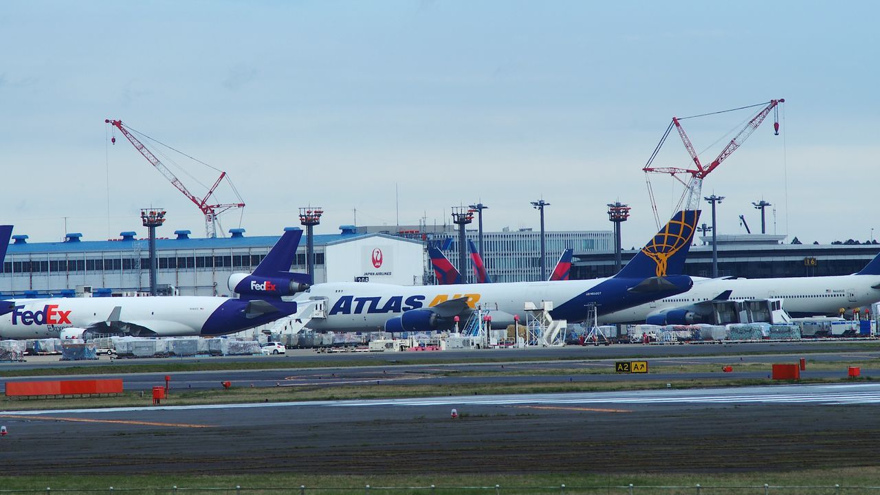 VIEW OF CRANES AT DUSK