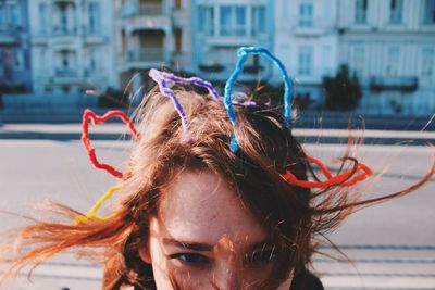 Portrait of young woman in city