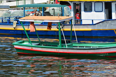 Fishing boats moored at harbor