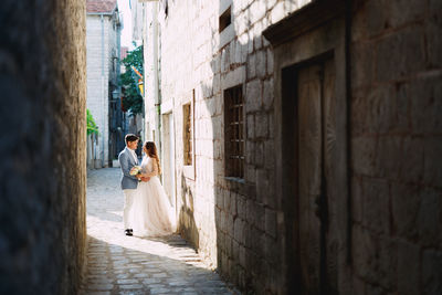 Full length of couple on road 