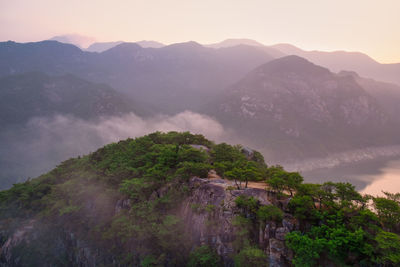 Scenic view of mountains against sky during sunrise