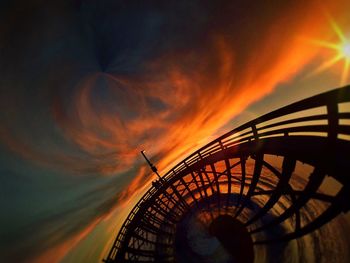 Low angle view of silhouette bridge against sky during sunset