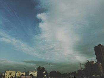 Low angle view of building against cloudy sky