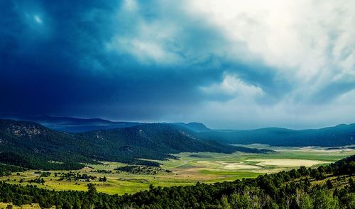 Scenic view of agricultural landscape against sky