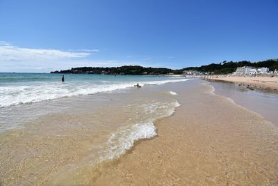 View of beach against clear sky