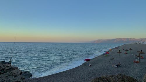 This photograph captures the serene beauty of oued laou beach in morocco during a golden sunset.