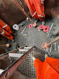 Low section of man working at workshop