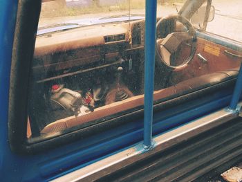 High angle view of cat seen through train window