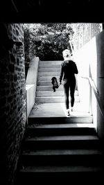 Woman walking up stairs