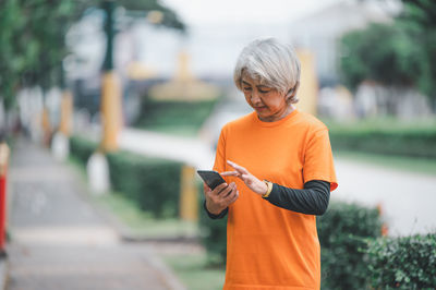 Young woman using mobile phone