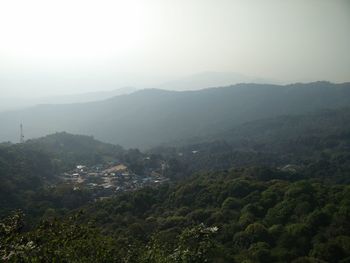 Scenic view of tree mountains against sky